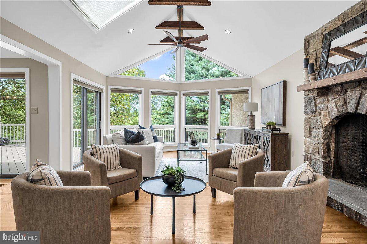 977 Wind Song Road West Chester, PA 19382 - Photo 16 of 57 a living room with fireplace furniture and a large window