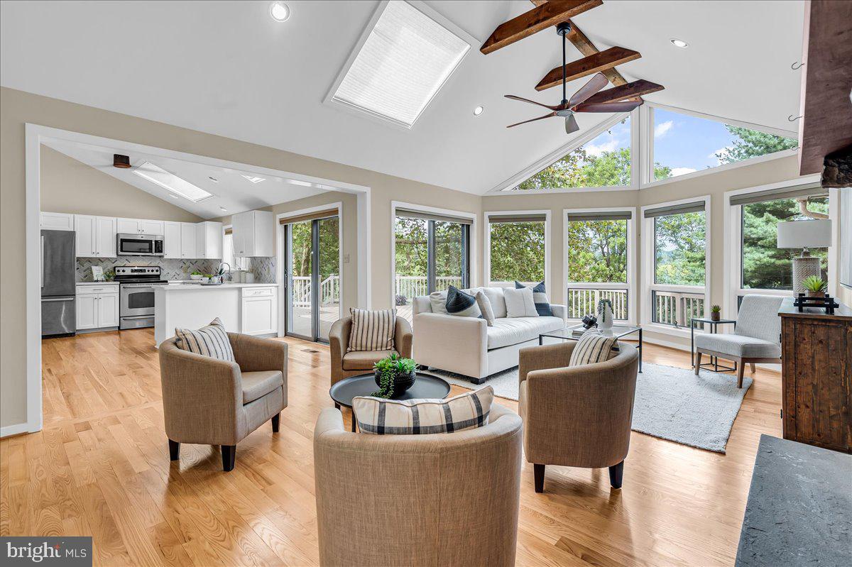 977 Wind Song Road West Chester, PA 19382 - Photo 17 of 57 a living room with furniture and a large window with outer view