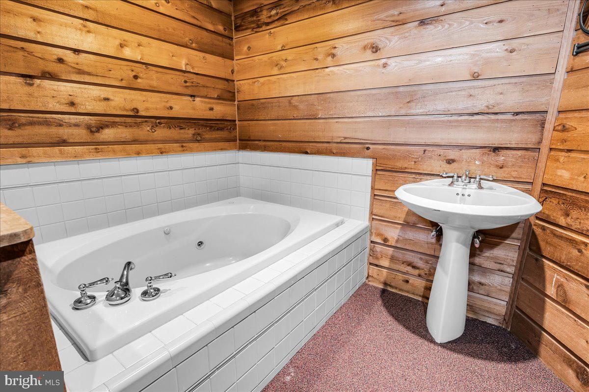 977 Wind Song Road West Chester, PA 19382 - Photo 41 of 57 a bathroom with a sink and a mirror