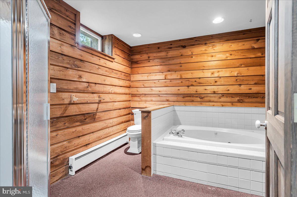 977 Wind Song Road West Chester, PA 19382 - Photo 42 of 57 a bathroom with a bathtub and shower
