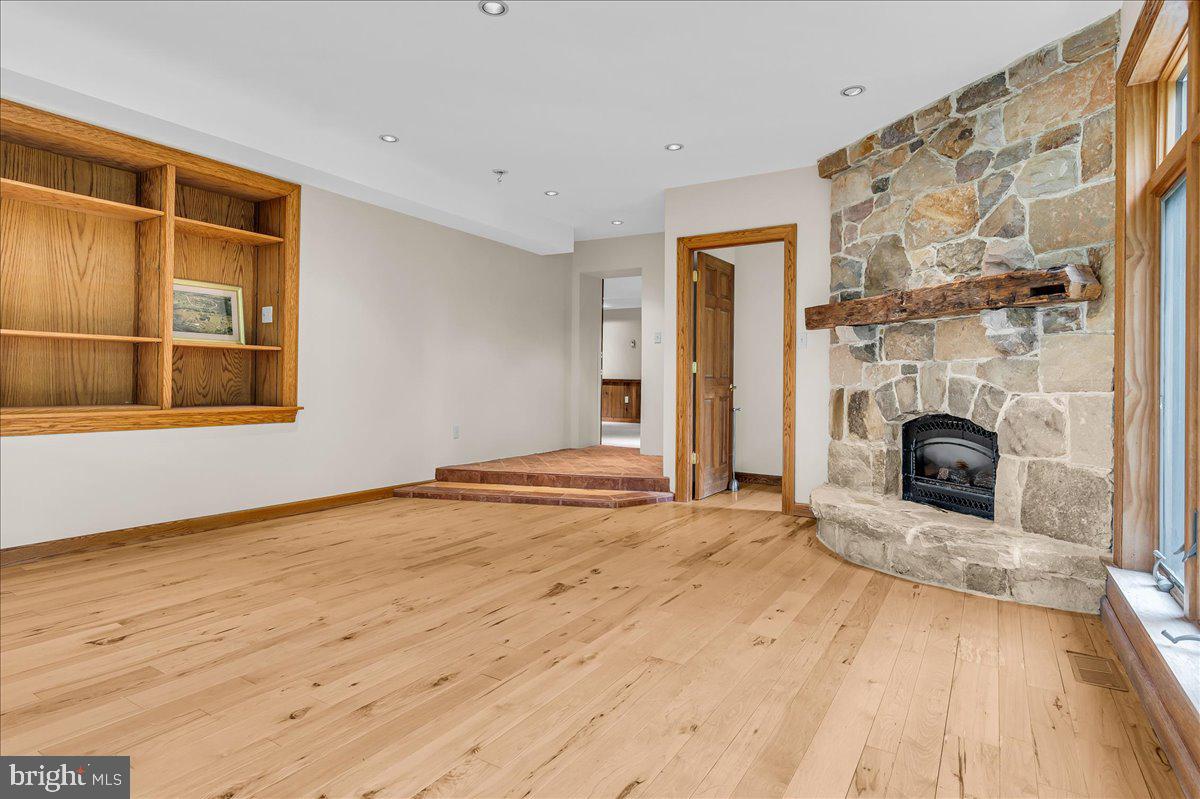 977 Wind Song Road West Chester, PA 19382 - Photo 44 of 57 a view of a livingroom with a fireplace and window