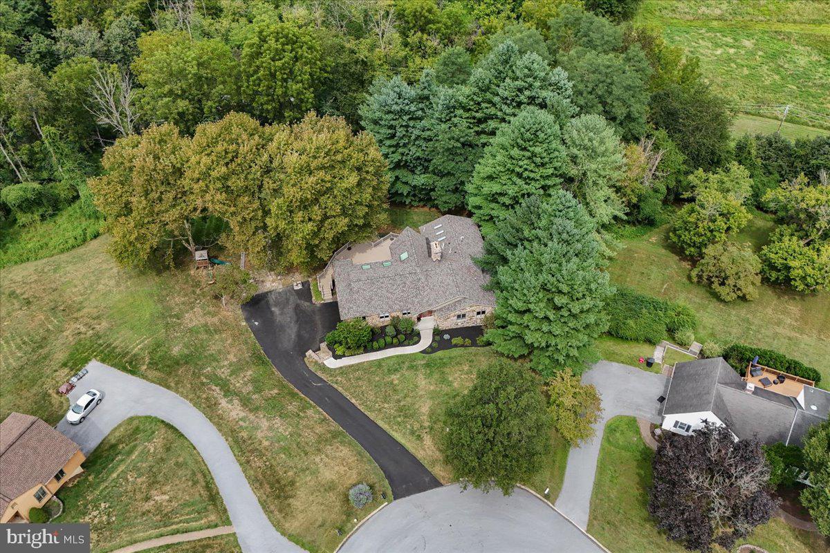 977 Wind Song Road West Chester, PA 19382 - Photo 54 of 57 an aerial view of a house with a yard and lake view