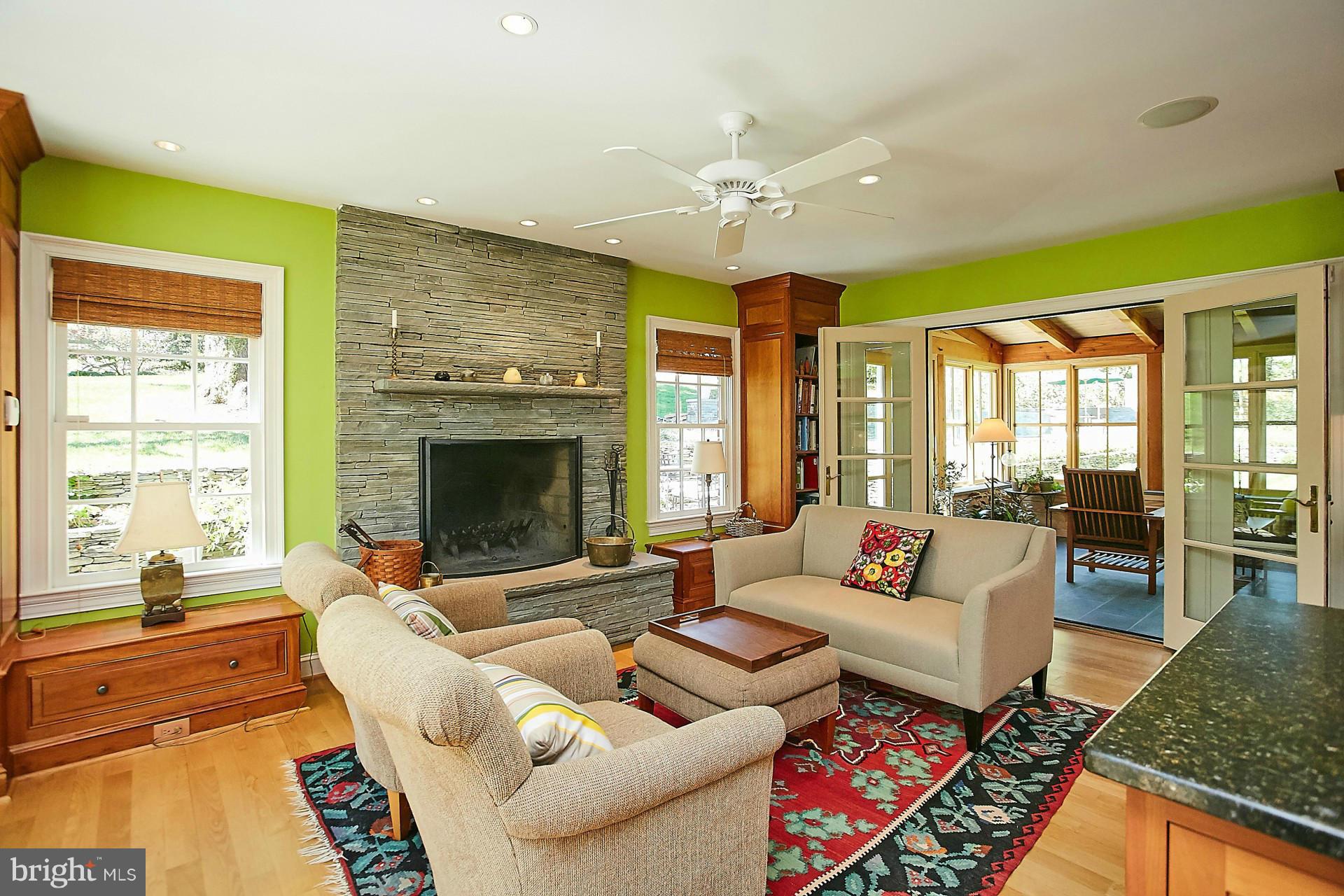 6539 Georgetown Pike McLean, VA 22101 - Photo 15 of 30 a living room with furniture fireplace and flat screen tv