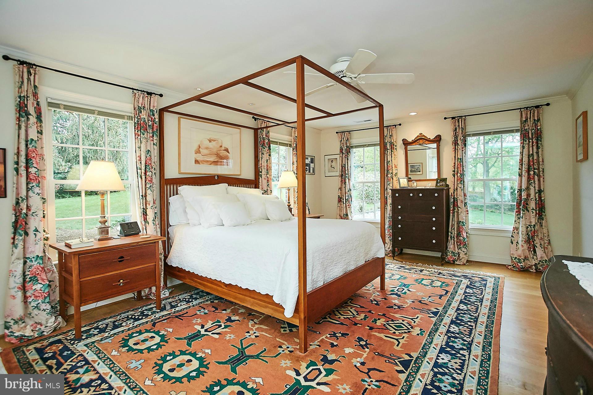 6539 Georgetown Pike McLean, VA 22101 - Photo 20 of 30 a bedroom with a bed and wooden floor