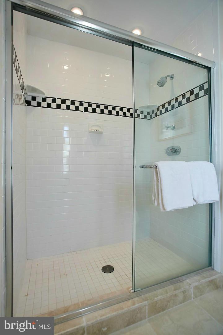 6539 Georgetown Pike McLean, VA 22101 - Photo 22 of 30 a bathroom with a shower