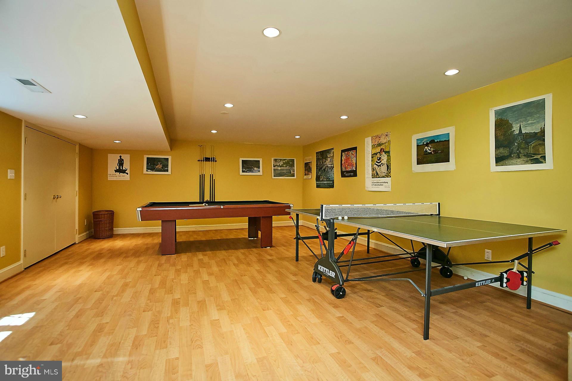 6539 Georgetown Pike McLean, VA 22101 - Photo 28 of 30 a living room with table tennis table and wooden floor