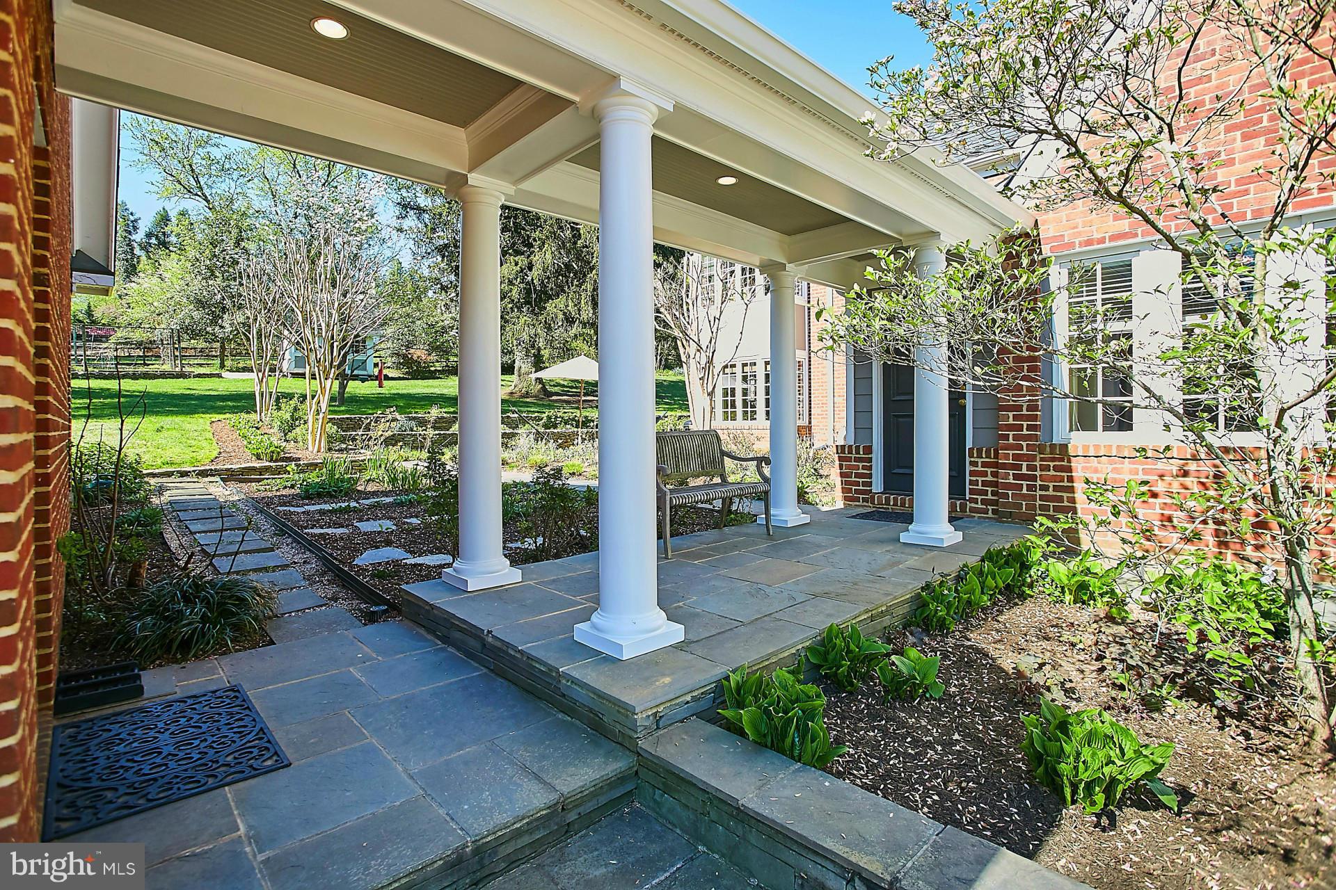6539 Georgetown Pike McLean, VA 22101 - Photo 29 of 30 a view of a patio with table and chairs potted plants and floor to ceiling window