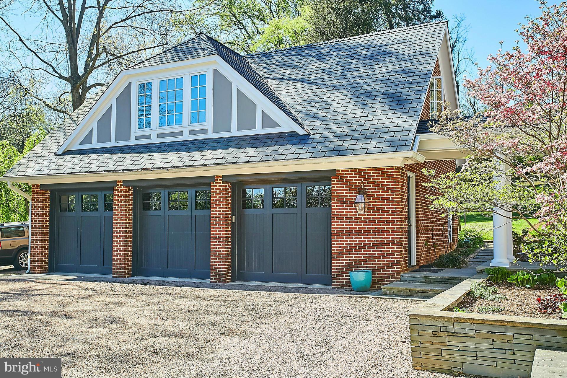 6539 Georgetown Pike McLean, VA 22101 - Photo 30 of 30 a front view of a house with garage