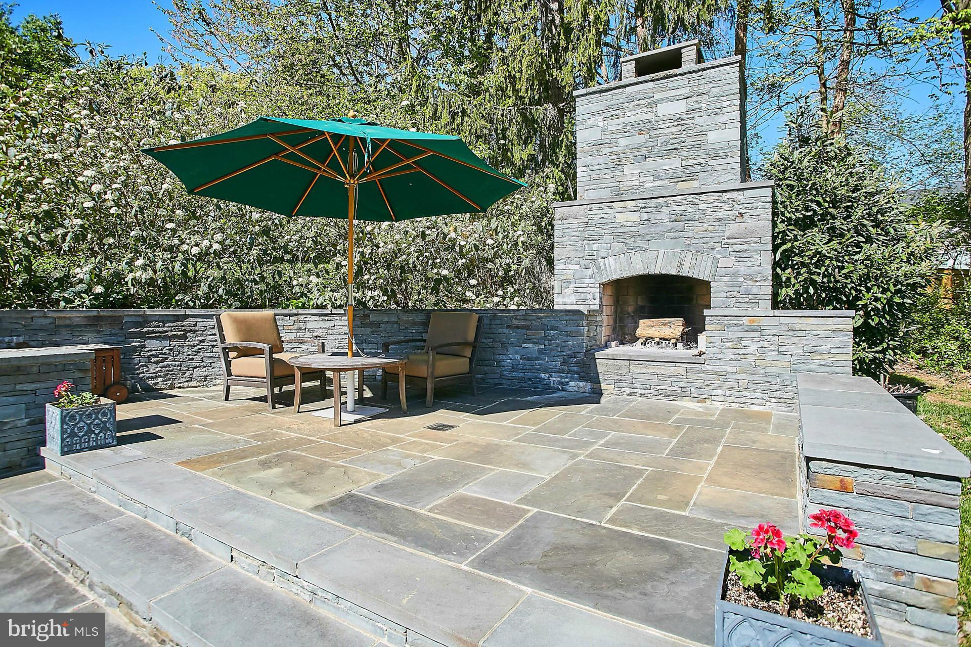 6539 Georgetown Pike McLean, VA 22101 - Photo 6 of 30 a view of a patio with a table and chairs under an umbrella