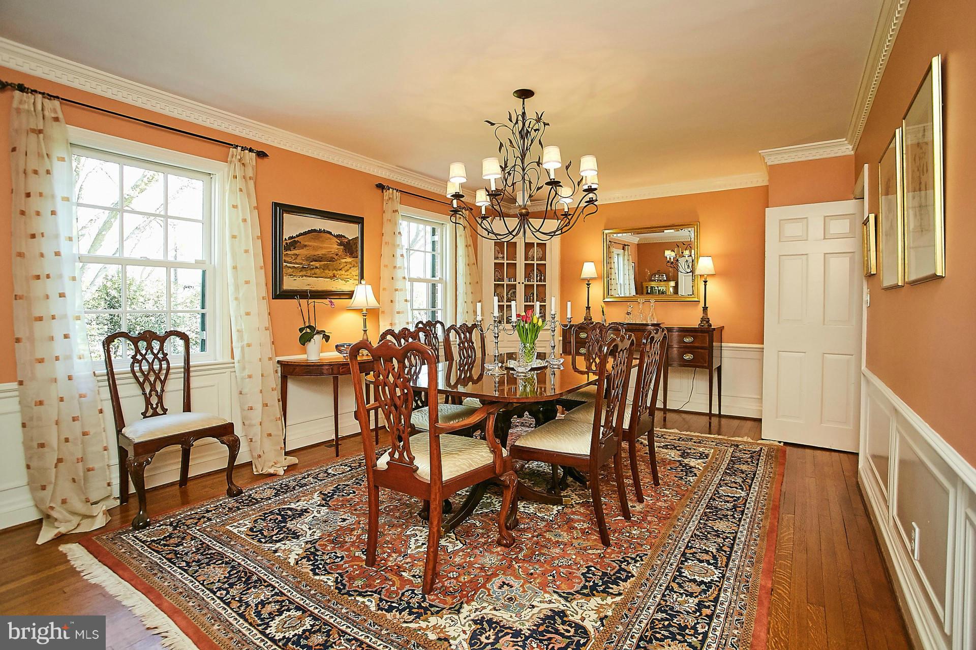 6539 Georgetown Pike McLean, VA 22101 - Photo 10 of 30 a view of a dining room with furniture a chandelier and wooden floor