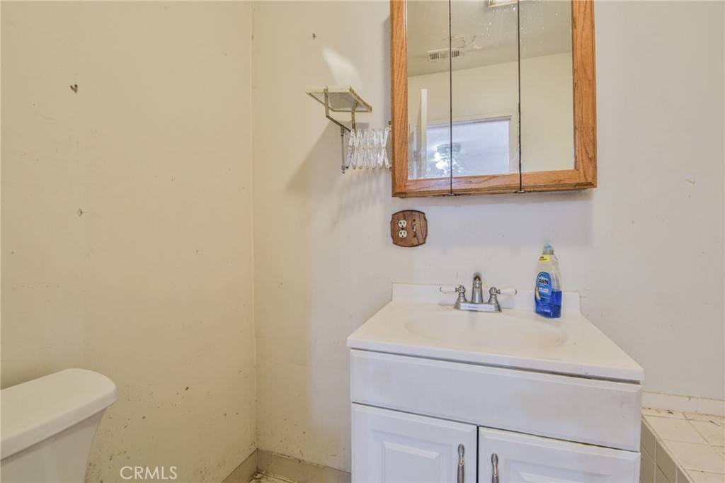 1208 South White Avenue Compton, CA 90221 - Photo 11 of 46 a bathroom with a sink and a toilet