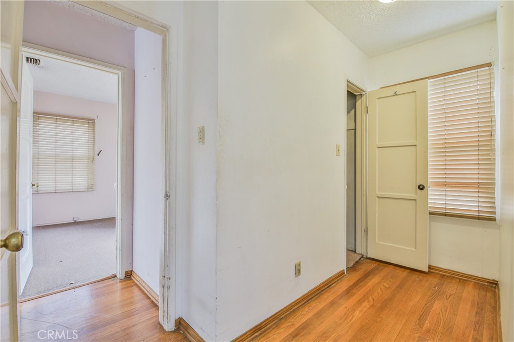 1208 South White Avenue Compton, CA 90221 - Photo 12 of 46 a view of a room with wooden floor and a bathroom