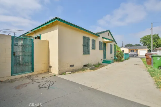 a aerial view of a house with a yard and lake view