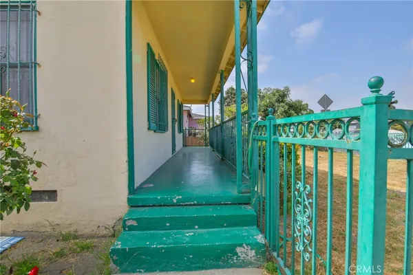 a front view of house with pathway and yard