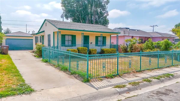 a view of a house with wooden floor and a yard