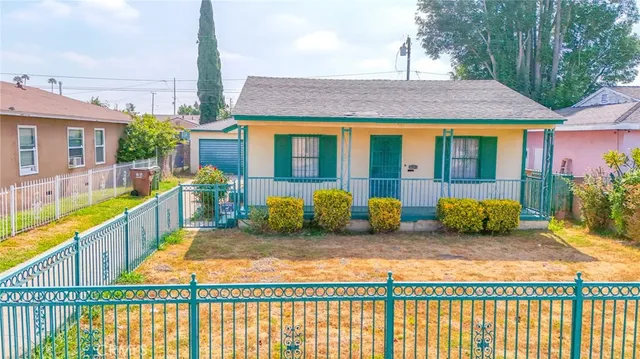 an aerial view of a house with a backyard