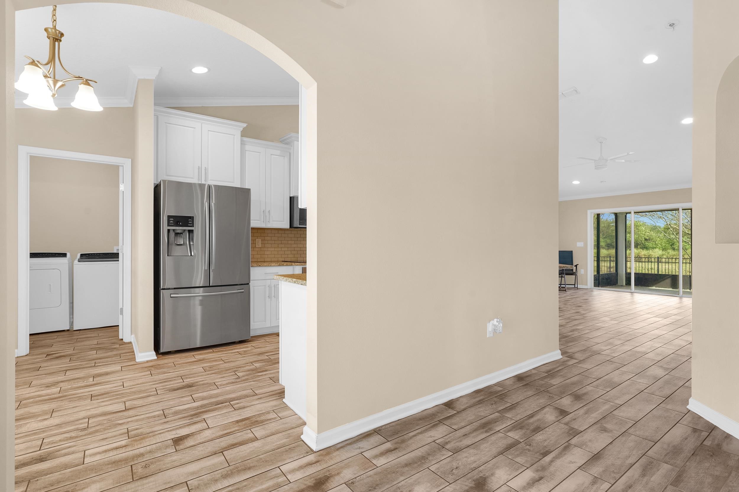 146 Ocean Cay Boulevard St. Augustine, FL 32080 - Photo 12 of 41 a kitchen with a refrigerator and a sink