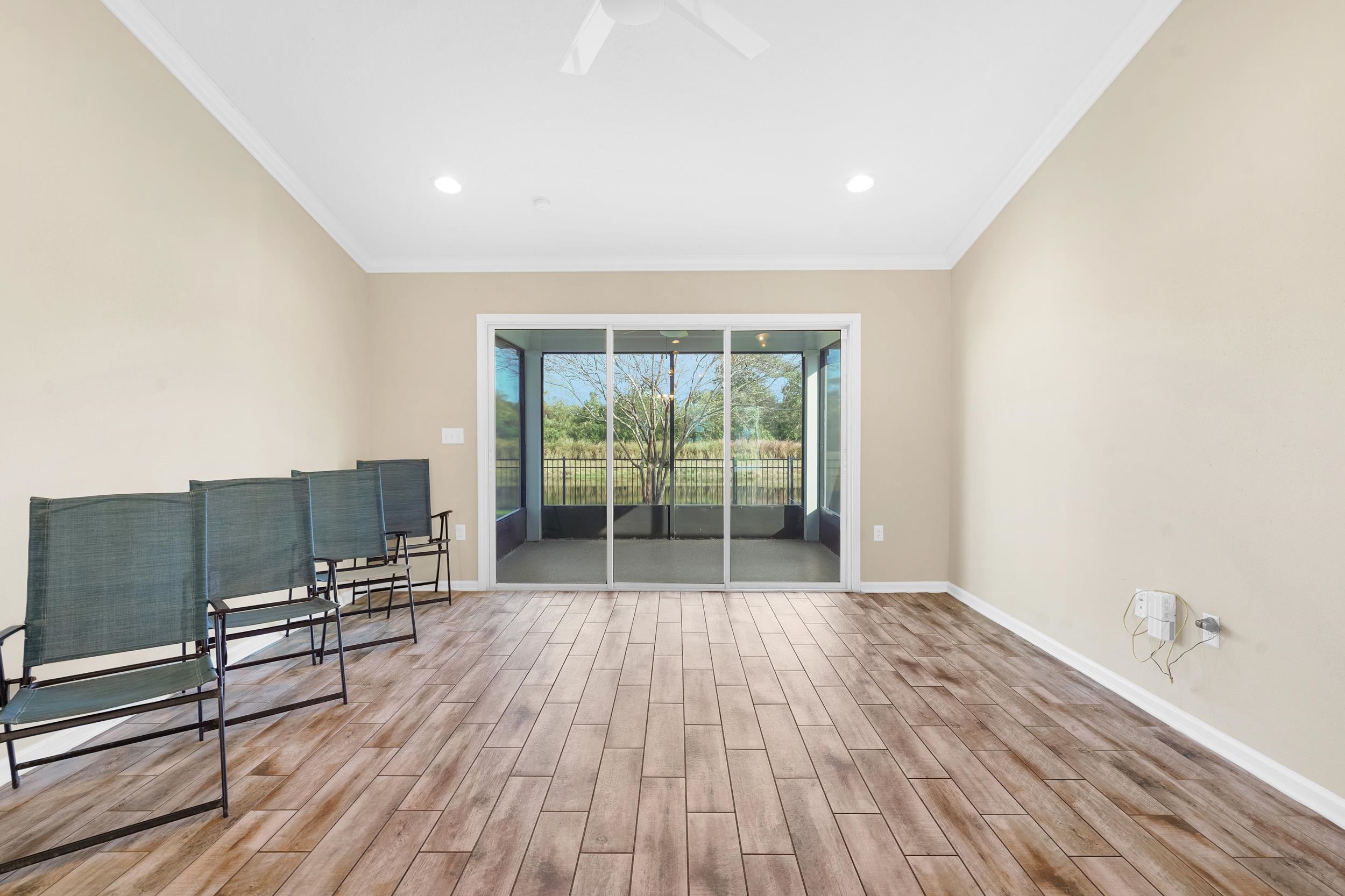 146 Ocean Cay Boulevard St. Augustine, FL 32080 - Photo 18 of 41 a view of room with wooden floor and furniture