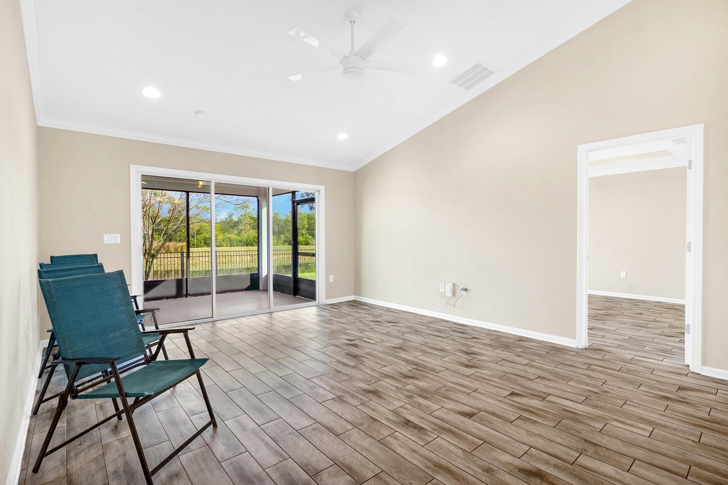 146 Ocean Cay Boulevard St. Augustine, FL 32080 - Photo 19 of 41 a view of an empty room with wooden floor and a window