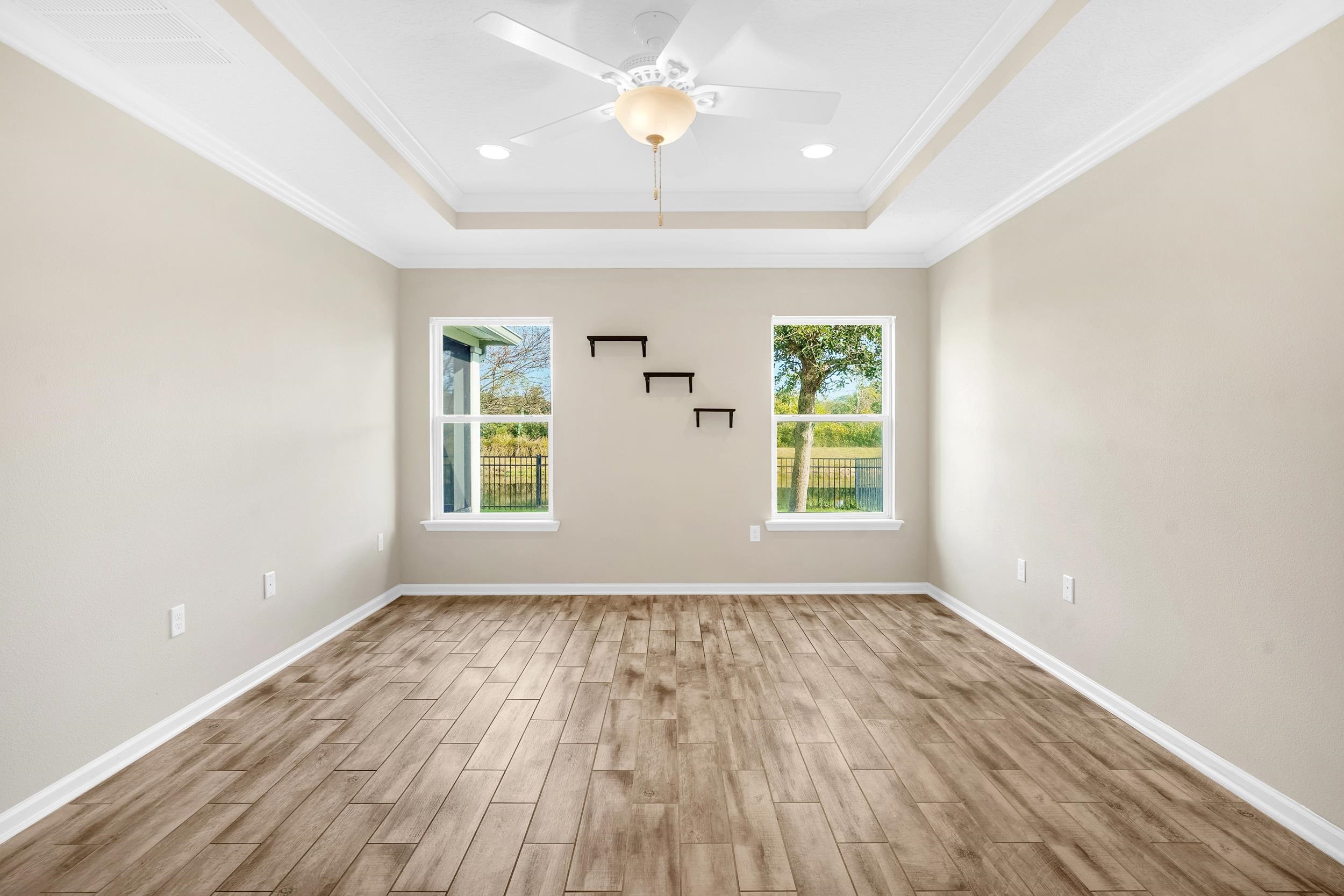 146 Ocean Cay Boulevard St. Augustine, FL 32080 - Photo 23 of 41 wooden floor in an empty room with a window