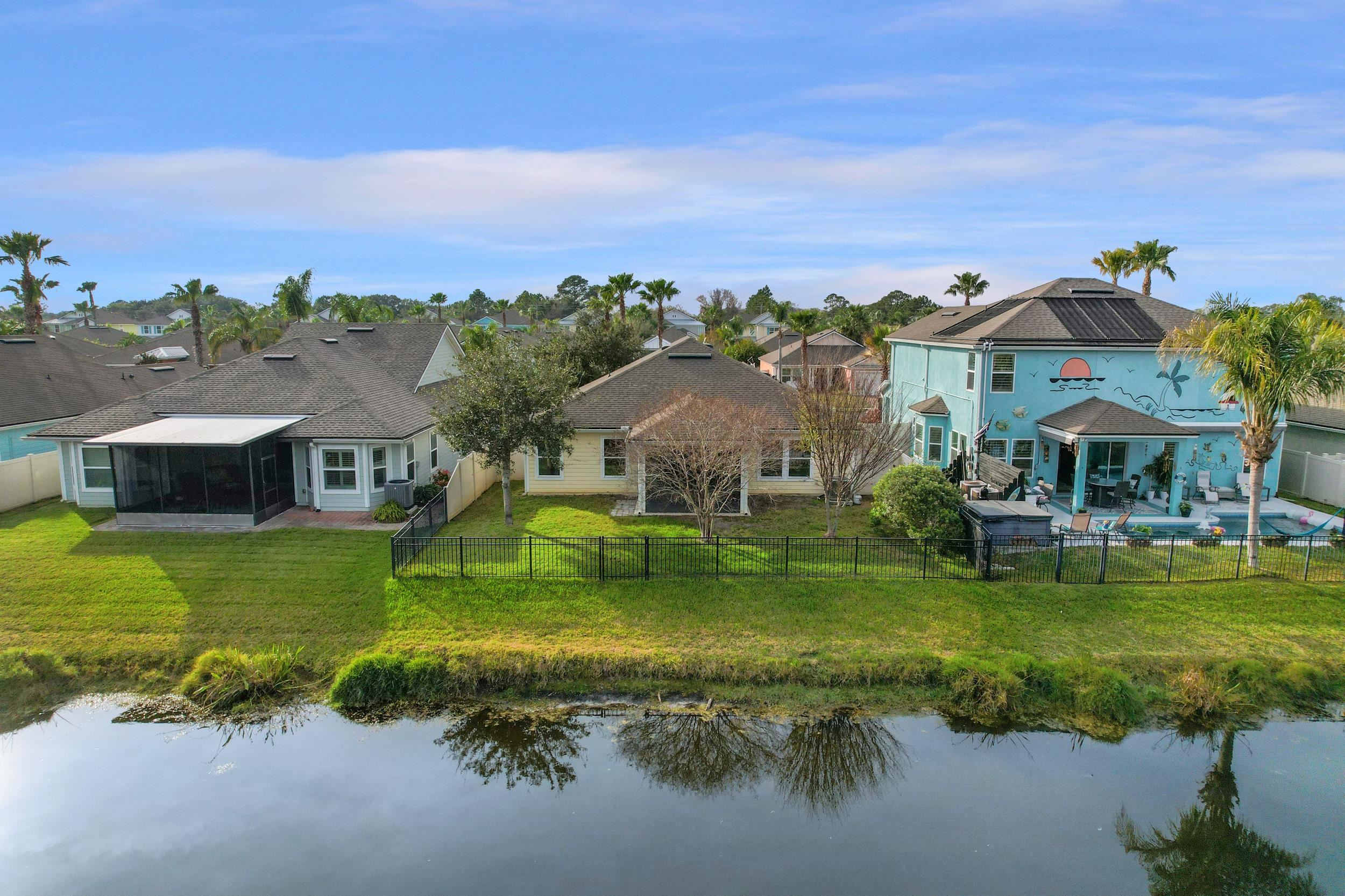 146 Ocean Cay Boulevard St. Augustine, FL 32080 - Photo 37 of 41 a aerial view of a house with a big yard