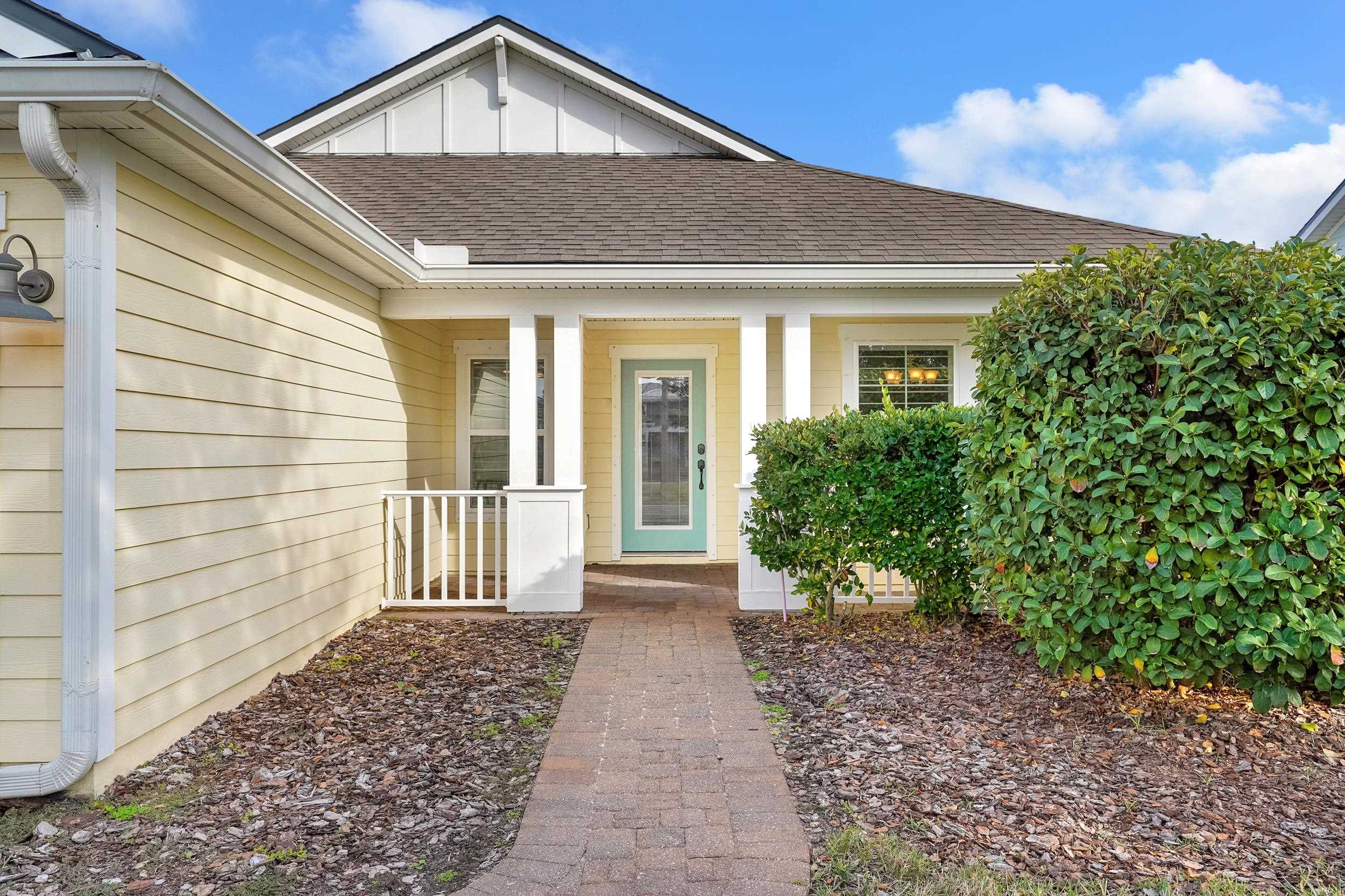 146 Ocean Cay Boulevard St. Augustine, FL 32080 - Photo 6 of 41 a front view of a house with a yard