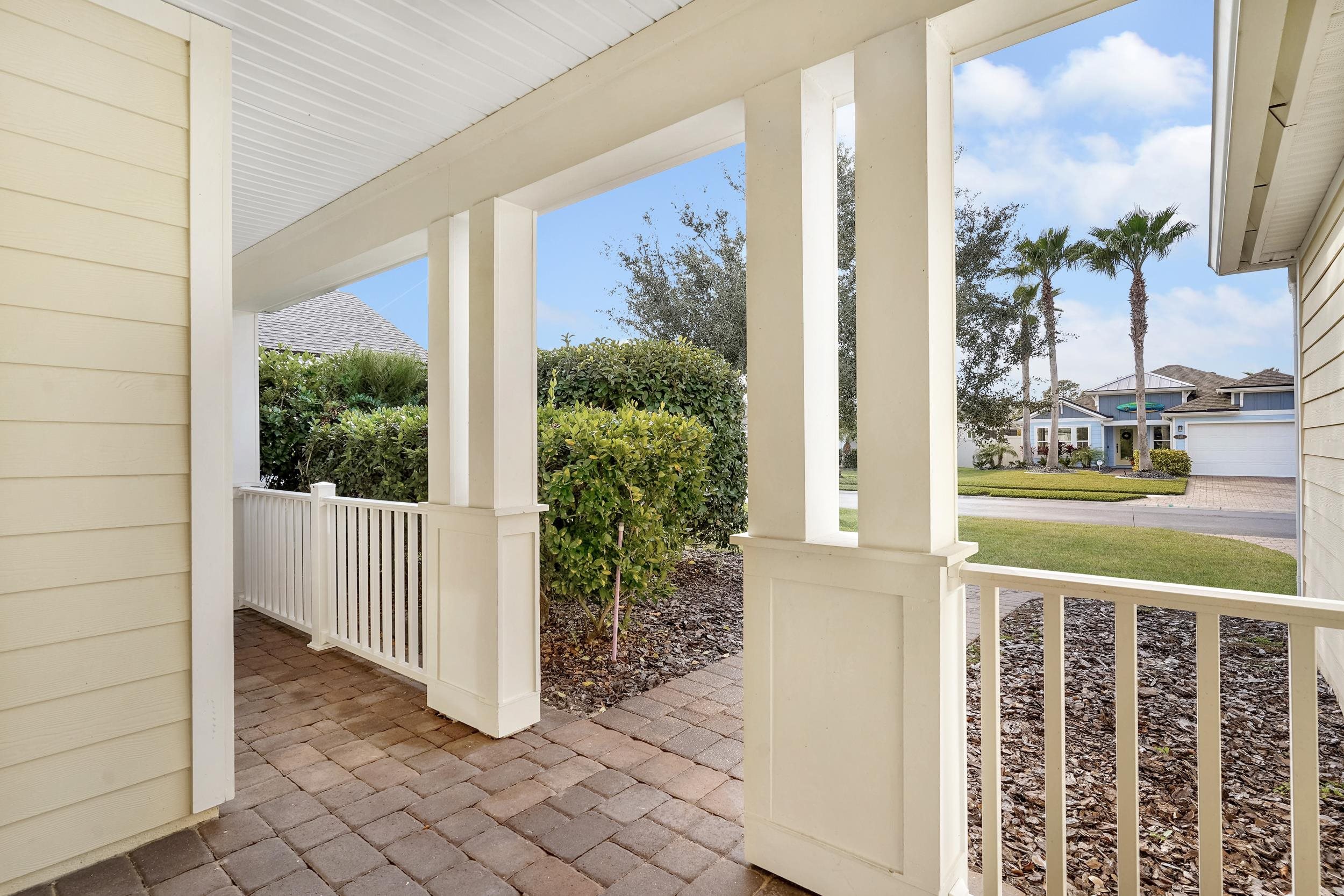 146 Ocean Cay Boulevard St. Augustine, FL 32080 - Photo 7 of 41 a view of a balcony with wooden floor and a yard