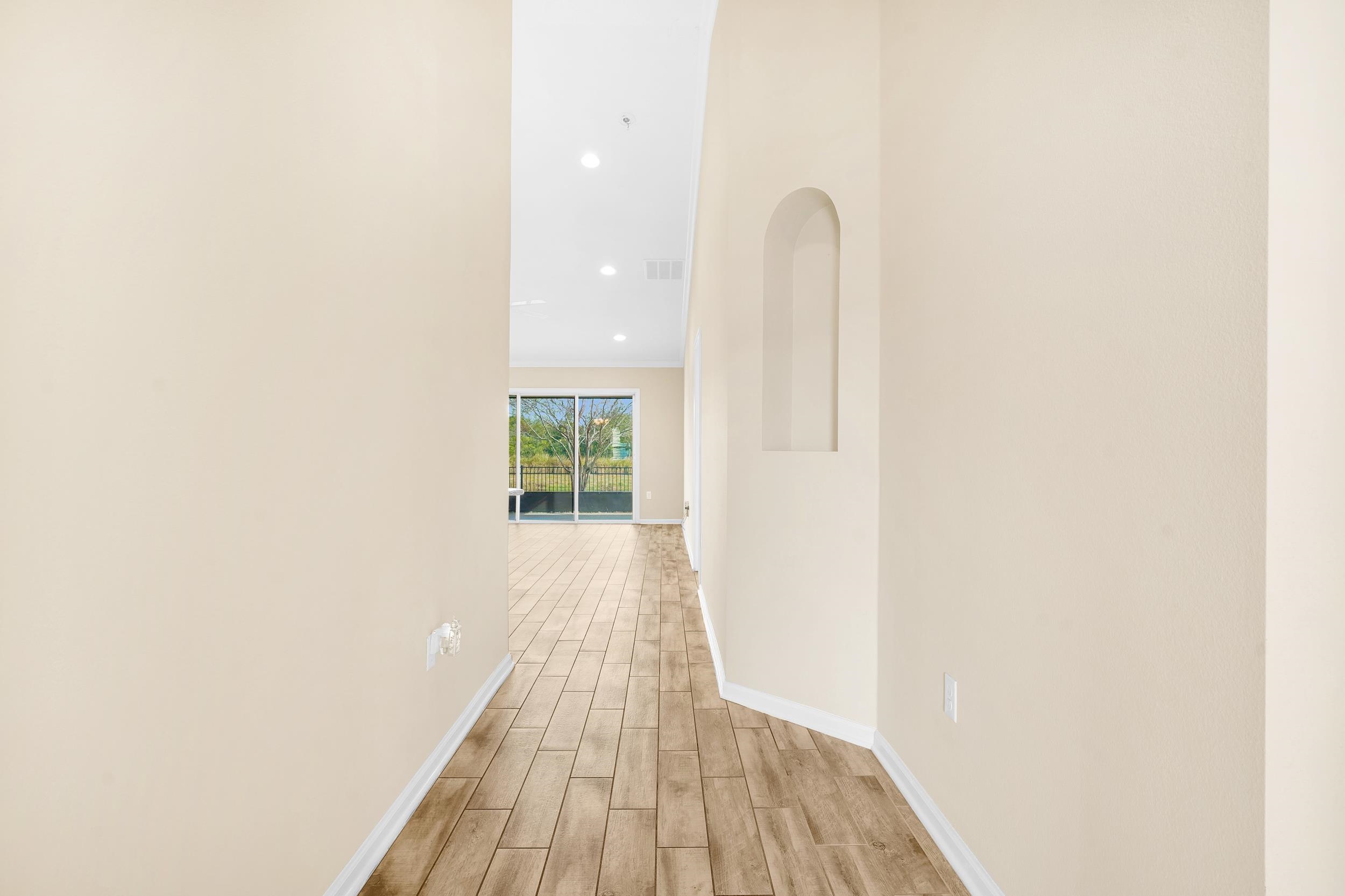 146 Ocean Cay Boulevard St. Augustine, FL 32080 - Photo 8 of 41 a view of a room with wooden floor and a window