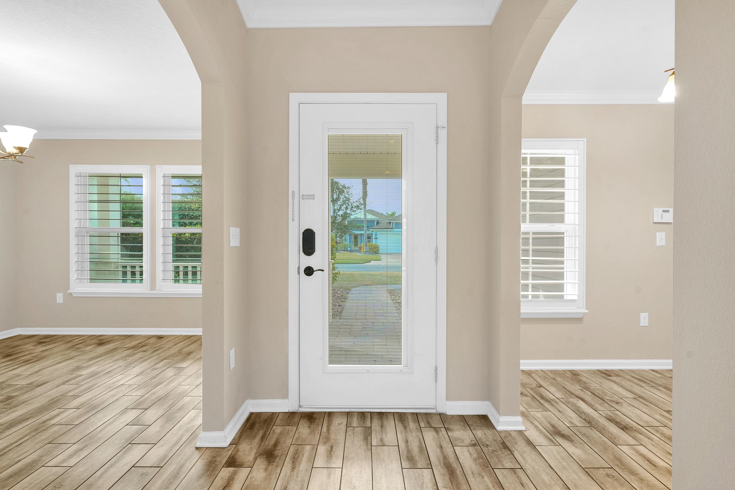 146 Ocean Cay Boulevard St. Augustine, FL 32080 - Photo 9 of 41 an empty room with wooden floor and windows