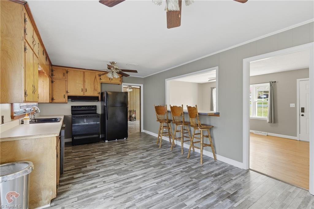 1313 Ridgewood Avenue Reidsville, NC 27320 - Photo 14 of 41 Kitchen and bar area that is overlooking the living room