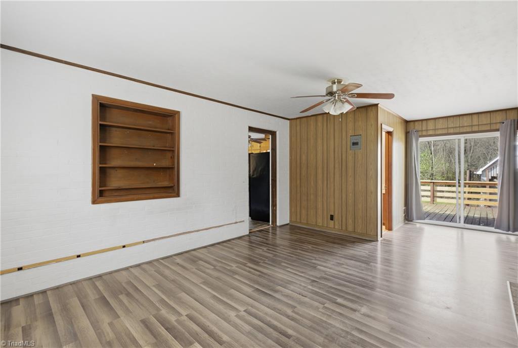 1313 Ridgewood Avenue Reidsville, NC 27320 - Photo 28 of 41 Another view of the flex room and the bathroom is beside the glass doors