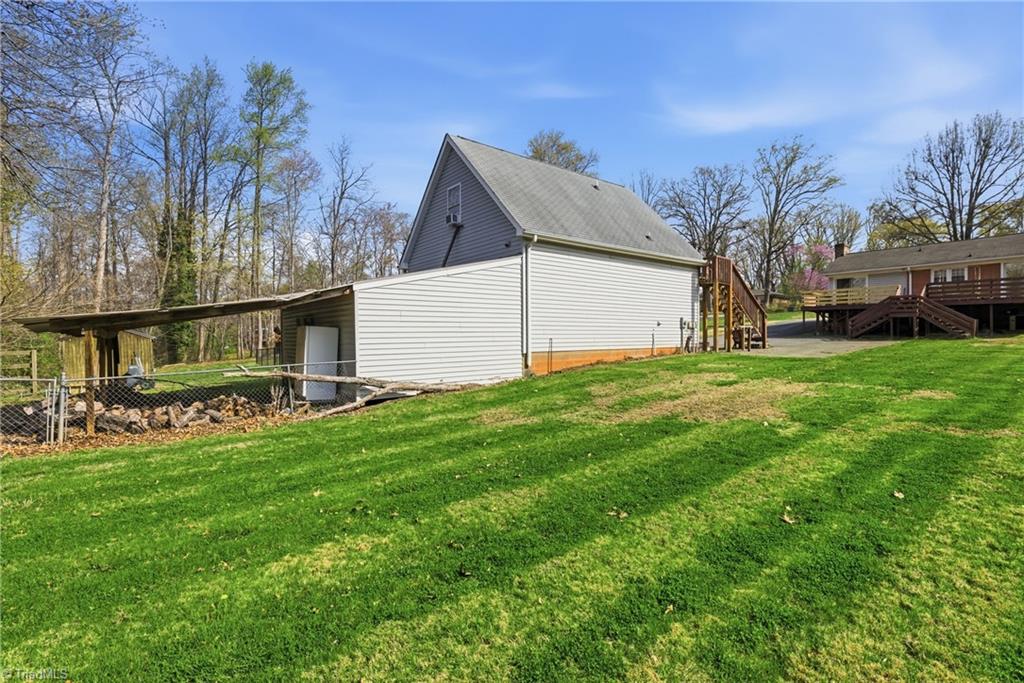 1313 Ridgewood Avenue Reidsville, NC 27320 - Photo 4 of 41 Backyard and view of the garage with lien too and bonus room off the back
