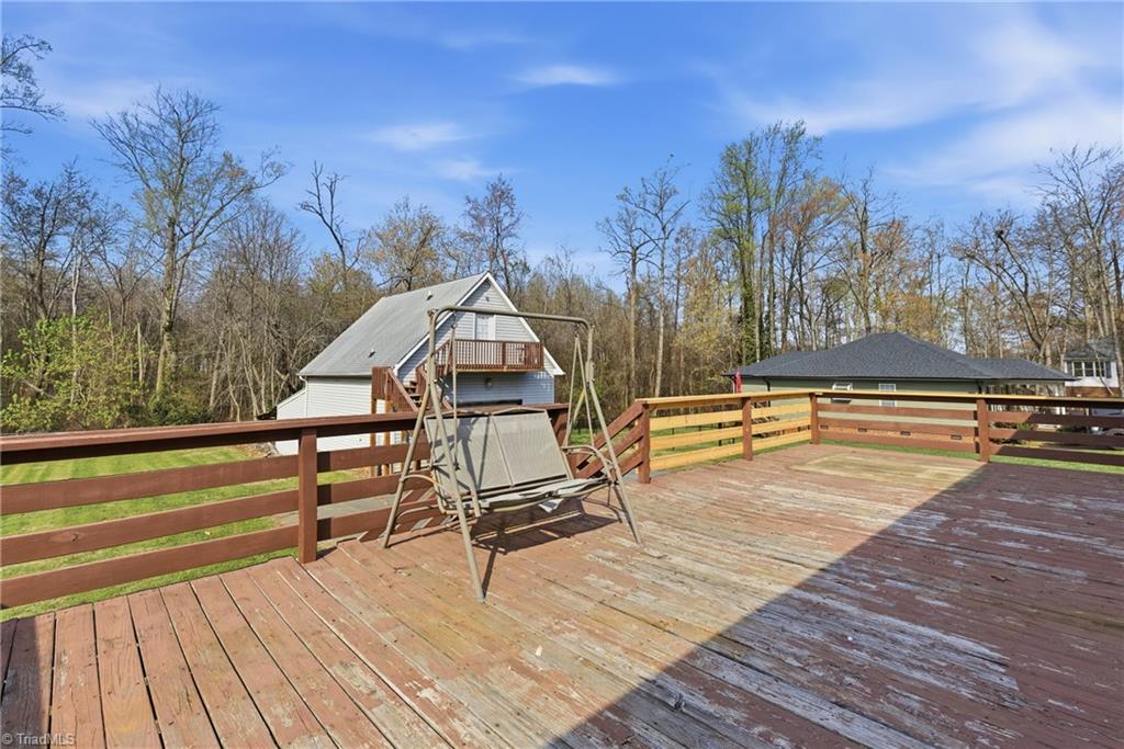1313 Ridgewood Avenue Reidsville, NC 27320 - Photo 5 of 41 Large deck off the back of the house with view of the backyard and garage