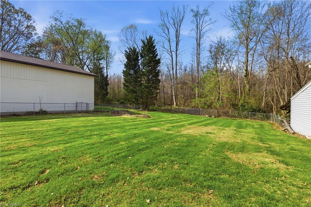1313 Ridgewood Avenue Reidsville, NC 27320 - Photo 7 of 41 Spacious back yard that is partially fenced in