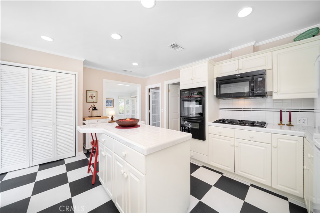 945 Cabrillo Drive Glendale, CA 91207 - Photo 11 of 38 a kitchen with a stove a sink and a refrigerator