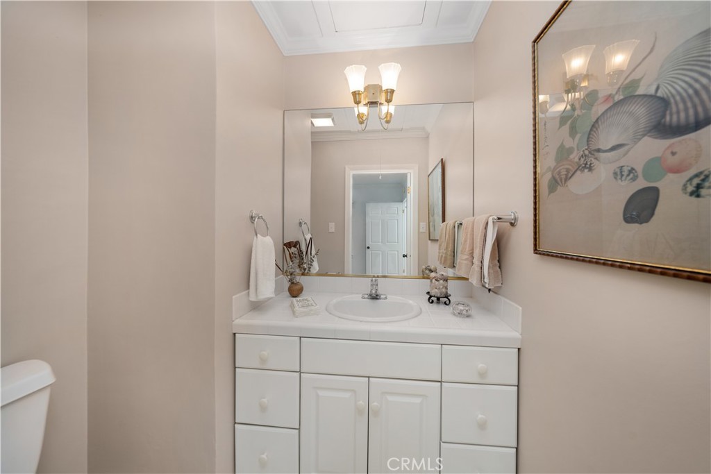 945 Cabrillo Drive Glendale, CA 91207 - Photo 16 of 38 a bathroom with a sink vanity and a mirror