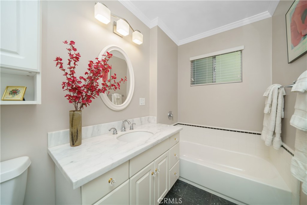 945 Cabrillo Drive Glendale, CA 91207 - Photo 27 of 38 a bathroom with a sink vanity and a mirror