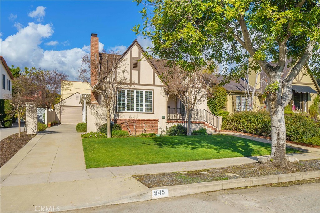 945 Cabrillo Drive Glendale, CA 91207 - Photo 34 of 38 a view of a white house next to a yard with big trees