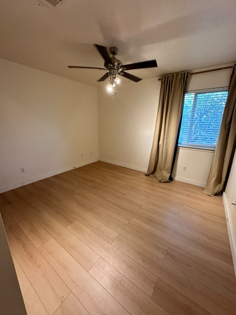 1981 Prairie Rock Way Round Rock, TX 78664 - Photo 15 of 22 Smooth wood floors anchor this comfortable room featuring a wide window.