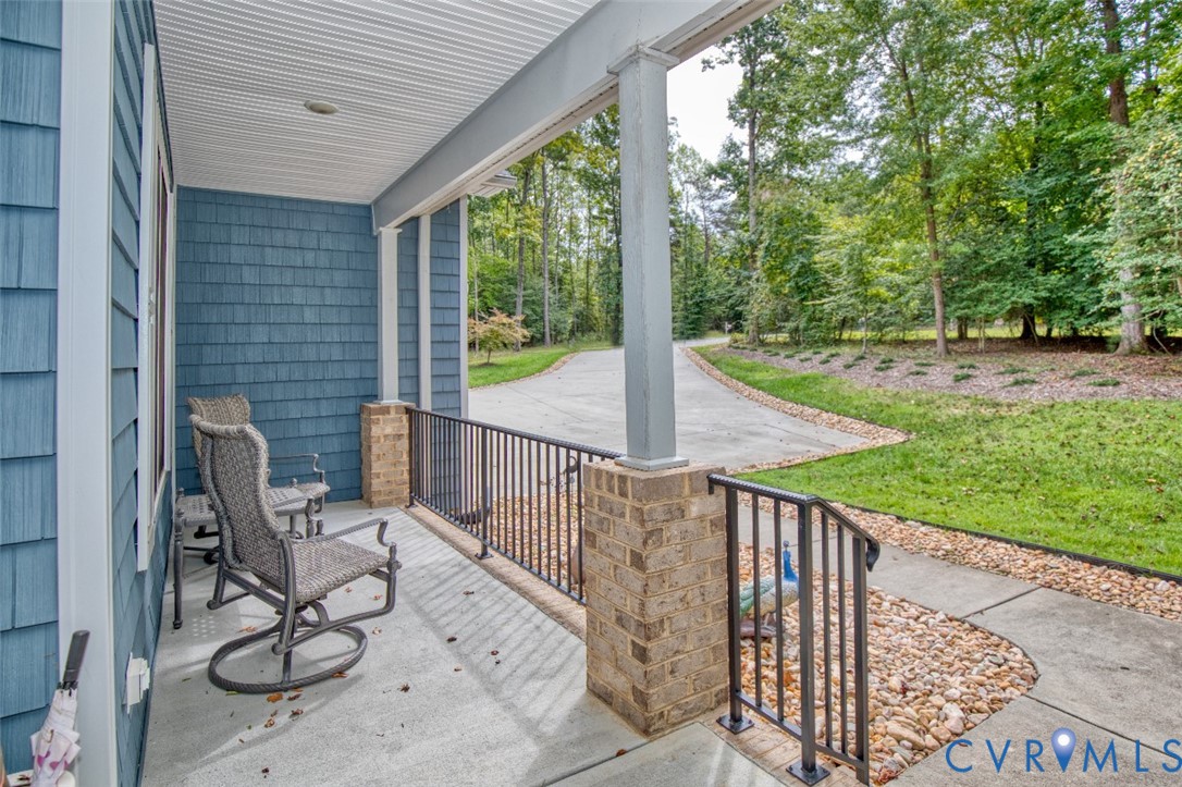 7075 Menzels Road Toano, VA 23168 - Photo 3 of 50 Covered front porch featuring blue shingle siding,
