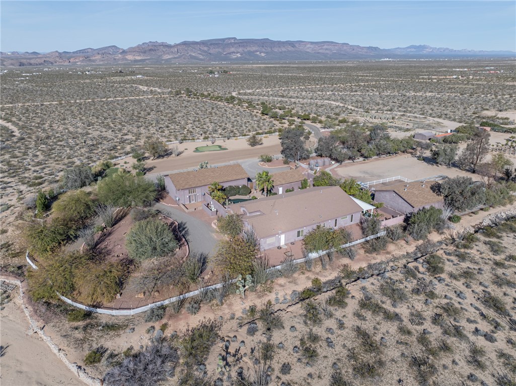 14158 Calabasas Road Yucca, AZ 86438 - Photo 11 of 99 Aerial overview of property location with a mountain backdrop and rural landscape