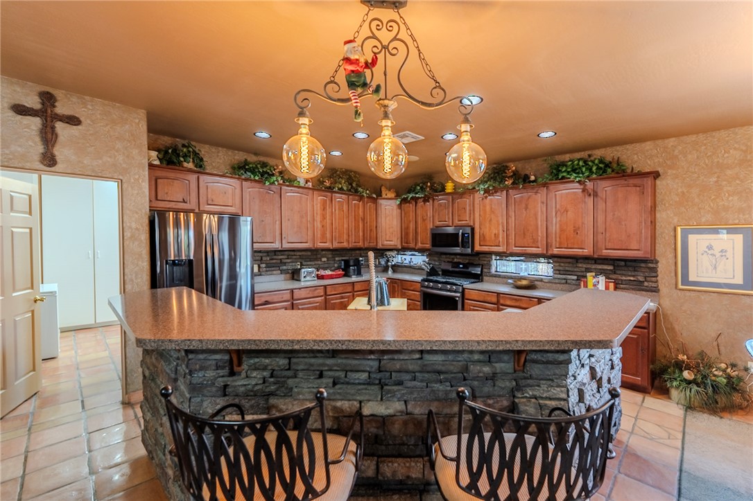 14158 Calabasas Road Yucca, AZ 86438 - Photo 42 of 99 a large kitchen with a table and chairs