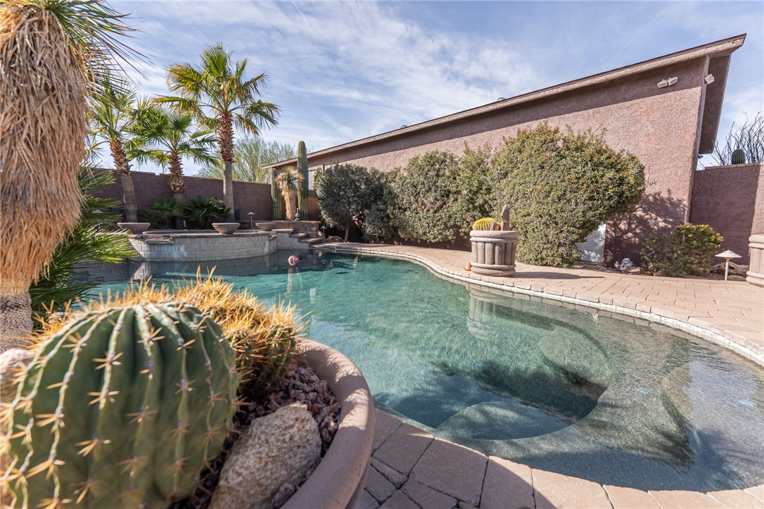 14158 Calabasas Road Yucca, AZ 86438 - Photo 74 of 99 View of swimming pool featuring a fenced backyard and patio surround