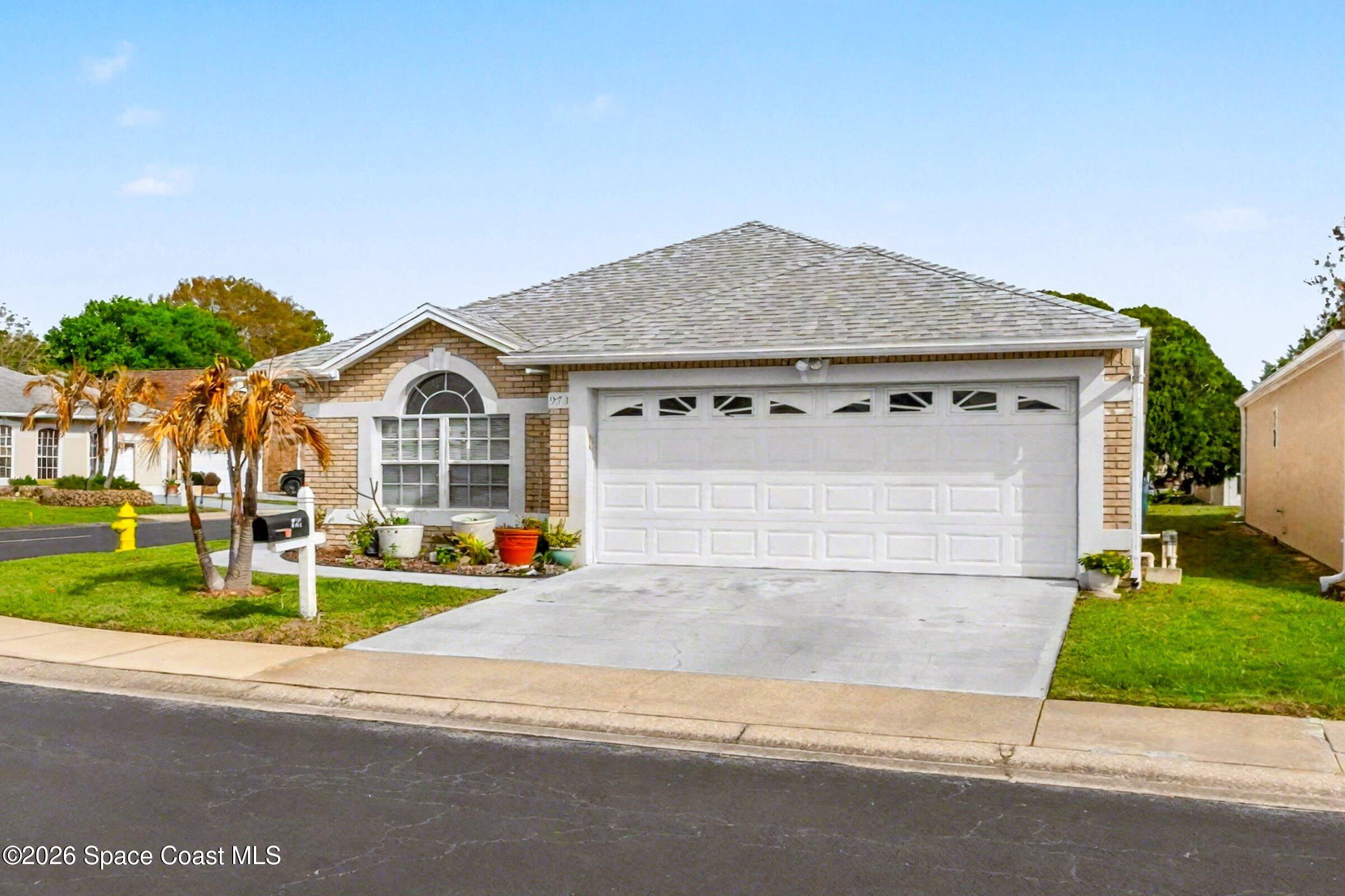 975 South Fork Circle Melbourne, FL 32901 - Photo 1 of 44 a view of house with outdoor space and parking