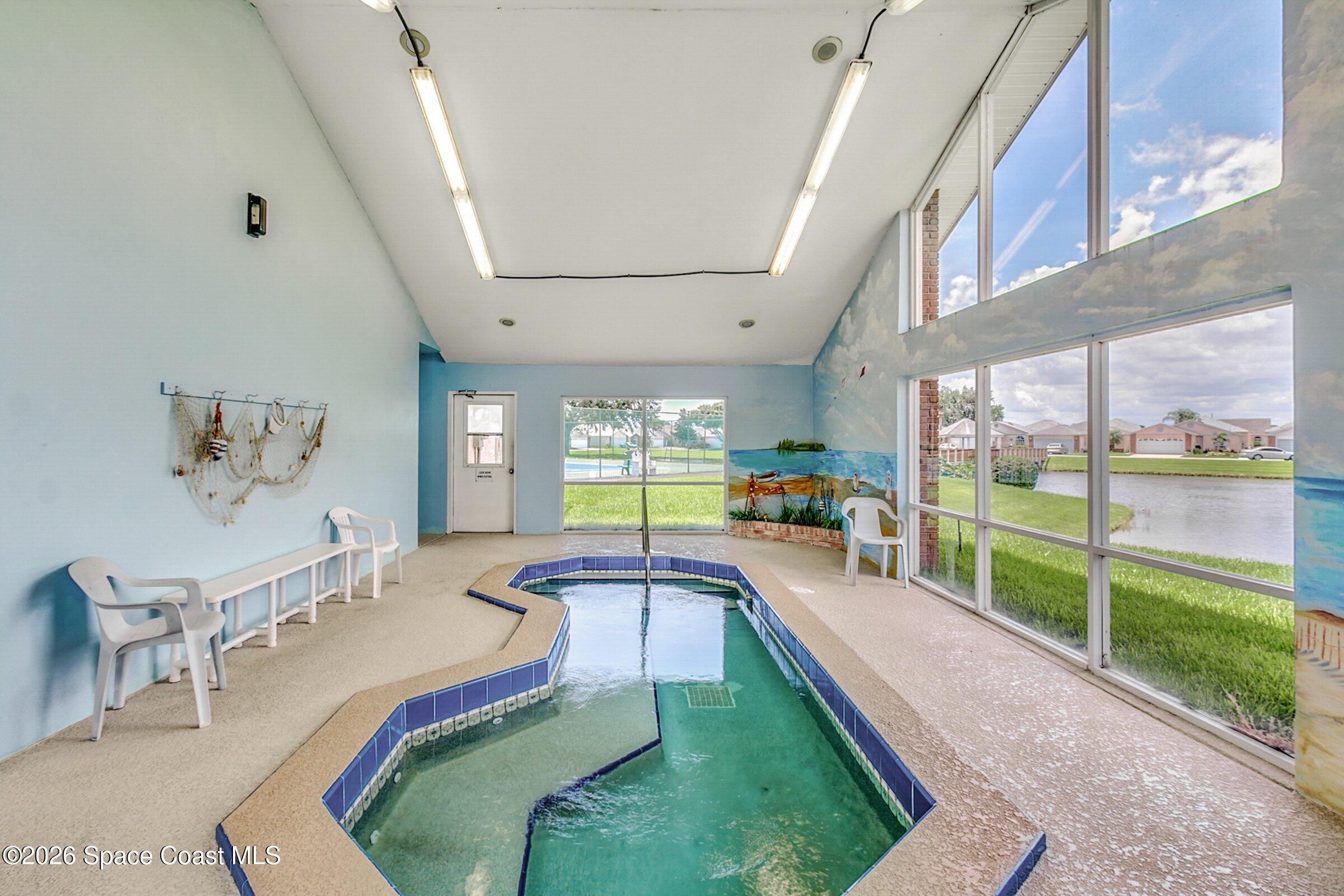 975 South Fork Circle Melbourne, FL 32901 - Photo 22 of 44 a room with lots of windows and furniture