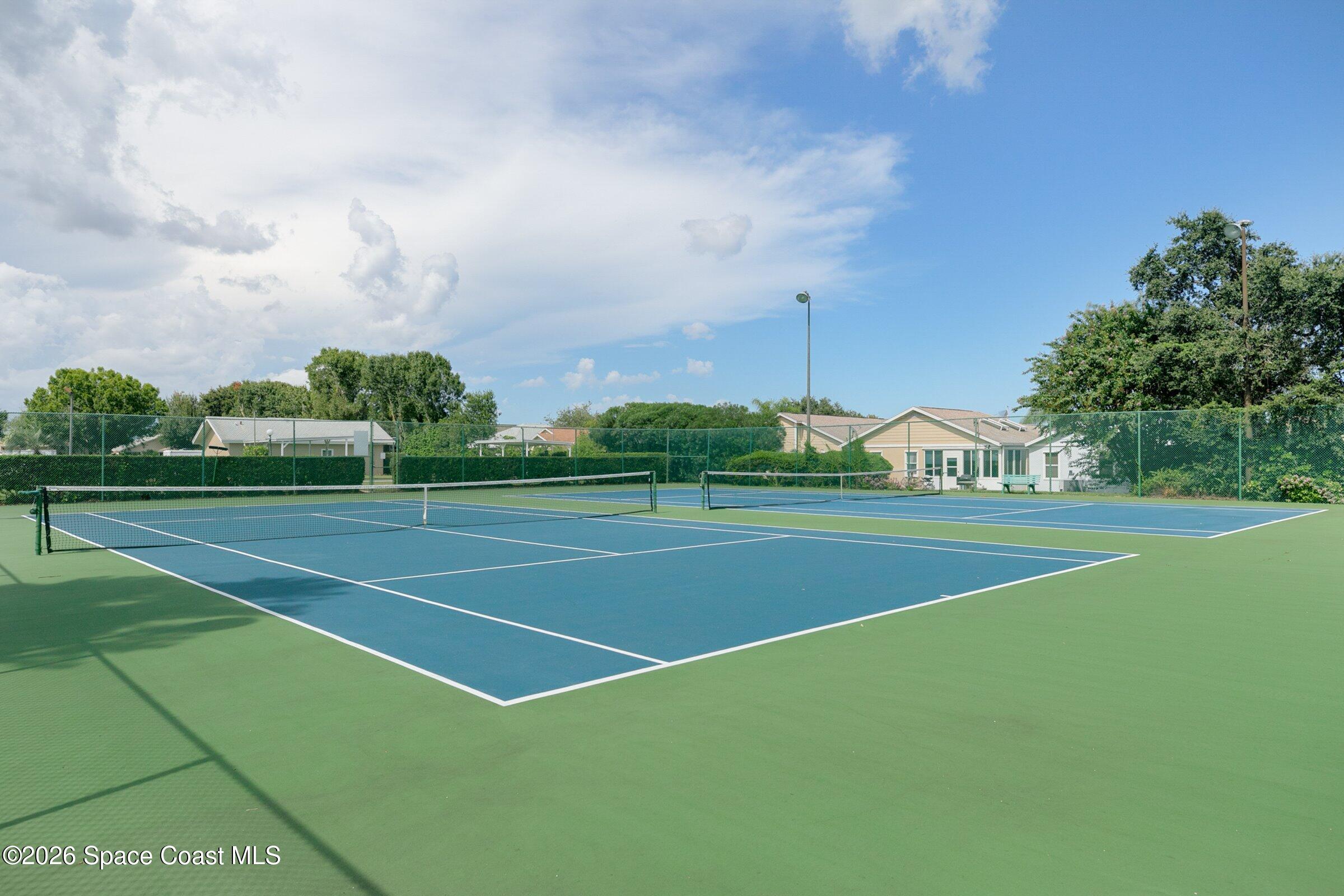 975 South Fork Circle Melbourne, FL 32901 - Photo 30 of 44 a view of an outdoor space and tennis court