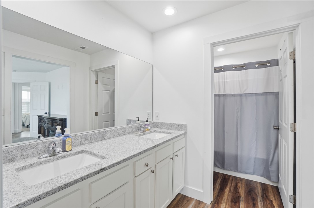 728 East Northern Avenue Springfield, OH 45503 - Photo 20 of 35 This bathroom features dual sinks and granite countertops, creating a harmonious and functional space.