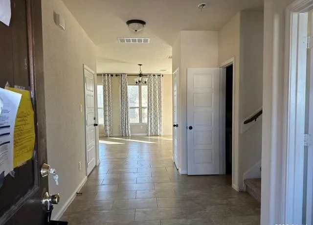 an empty room with a empty space and a window