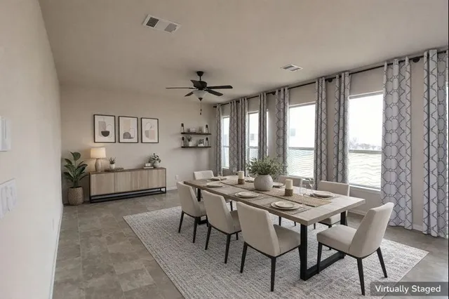 a view of a dining room with furniture and window