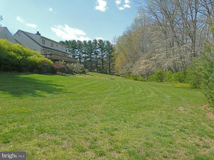 16 Manor Brook Road Monkton, MD 21111 - Photo 2 of 30 a view of a big yard with large trees